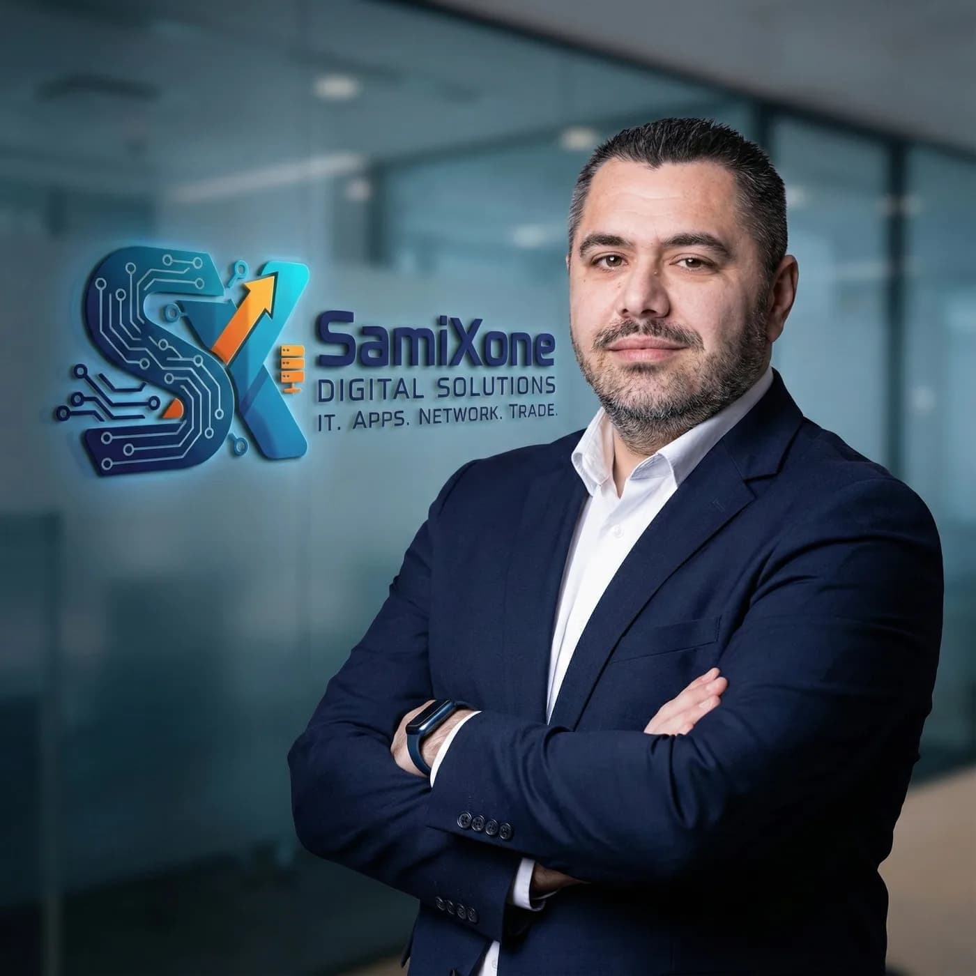 Samir Brkic, founder of SamiXone Digital Solutions, in an office with a glass wall and the company logo